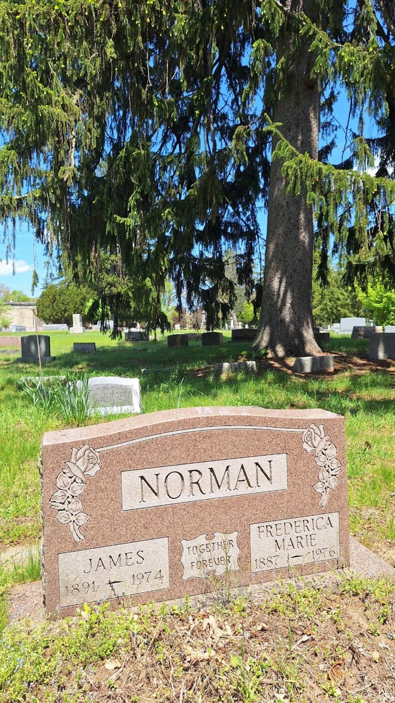 Granite headstone reading NORMAN, James 1891–1974, Frederica Marie 1887–1976, Together Forever